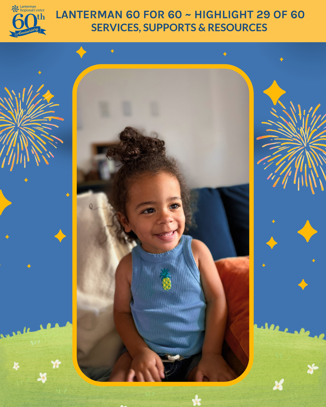 A photo of a smiling toddler girl in a blue pineapple-print top, with a festive fireworks-themed background.